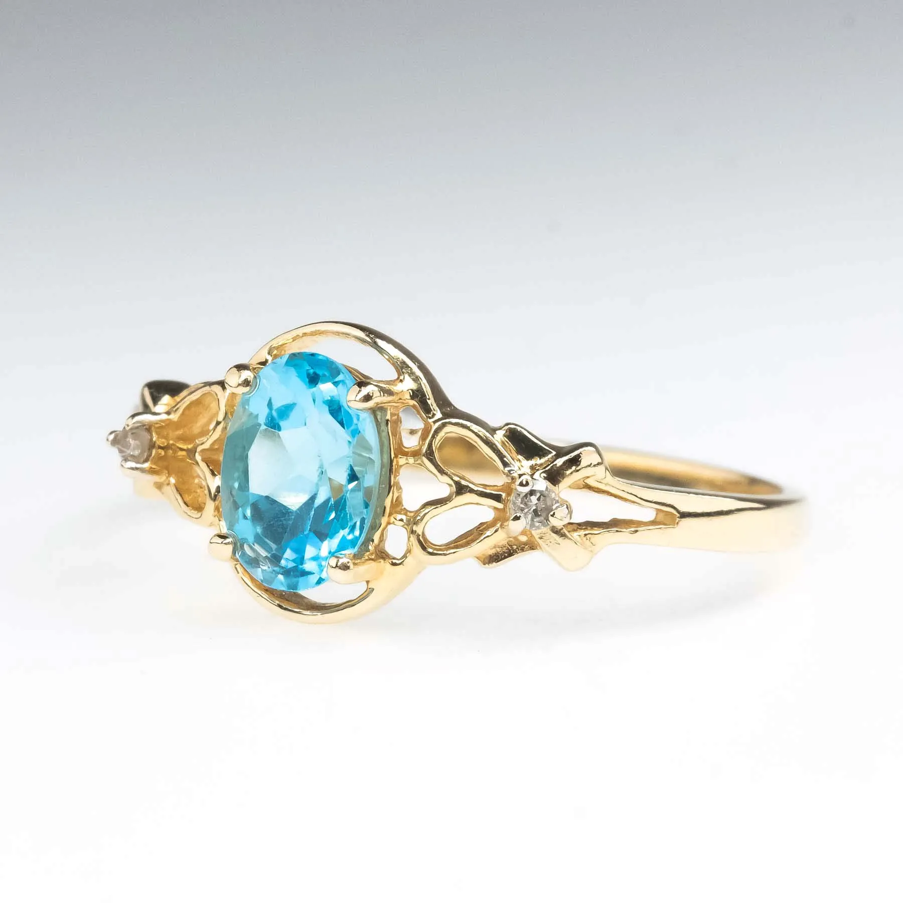 0.94ct Swiss Blue Topaz with Diamond Accents Gemstone Ring in 14K Yellow Gold